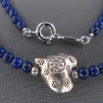 Lapis and silver charm detail
